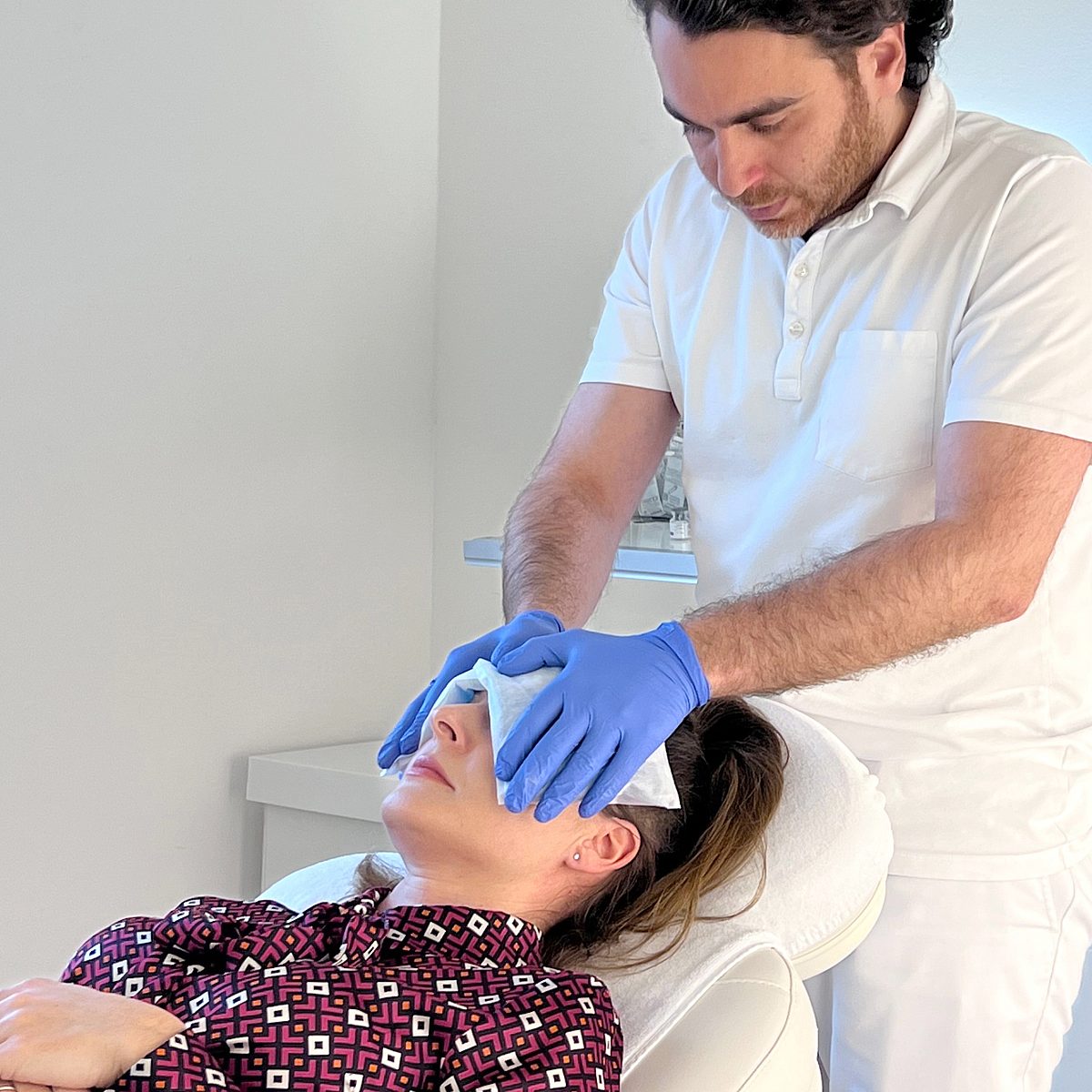 Photo of Ekaterina during cooling of the treated facial regions after her botulinum toxin treatment