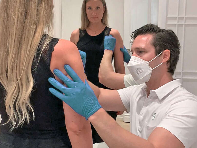 Photo of Anni's bra bulge area while the doctor marks the areas to be treated