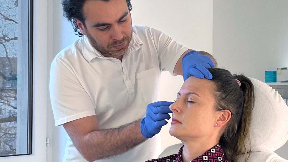 Photo of Ekaterina on the treatment couch during Botulinum toxin treatment at Smoothline